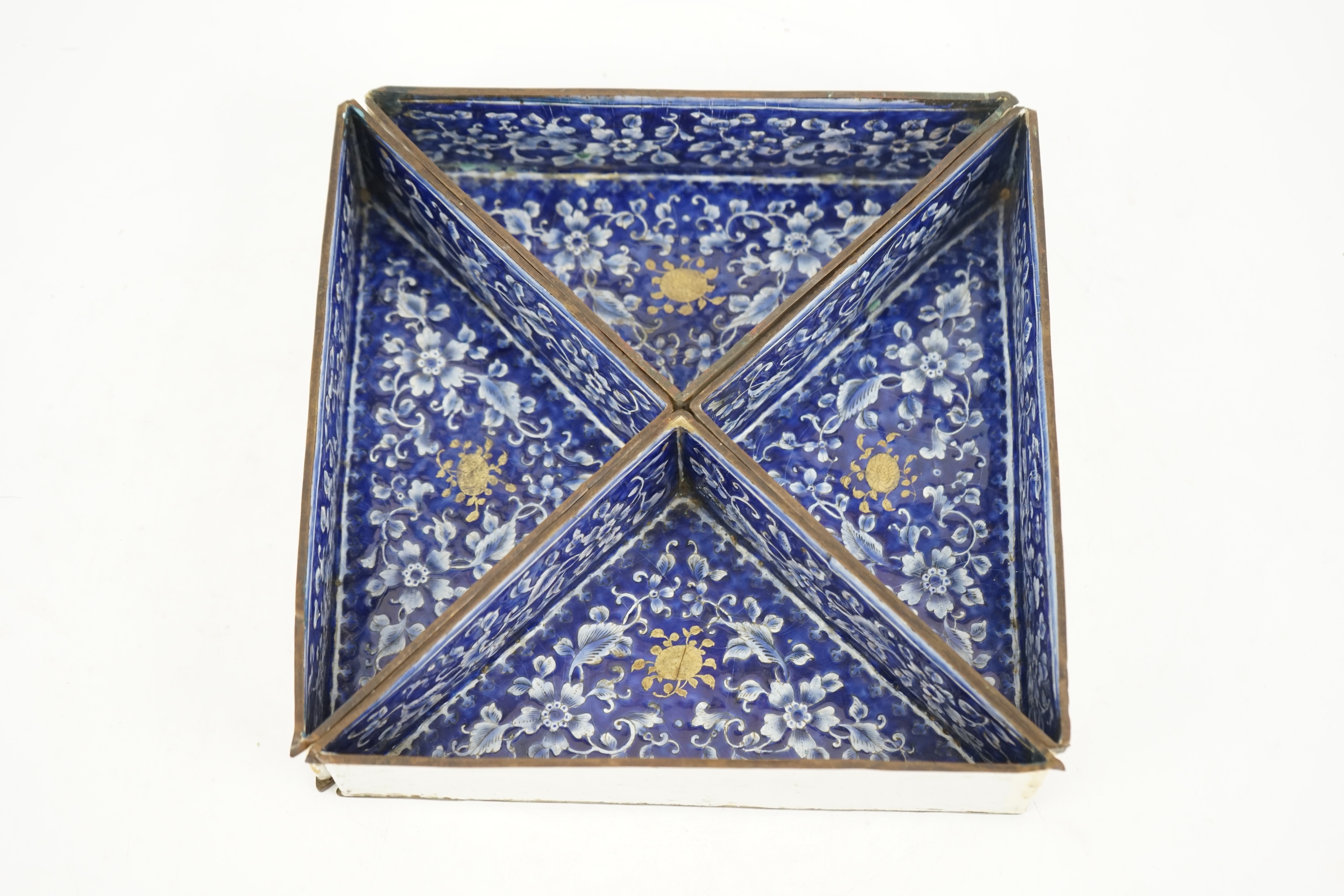 Four triangular 19th century Chinese Canton enamel sectional dishes, later boxed, 24cm wide overall. Condition - some restoration